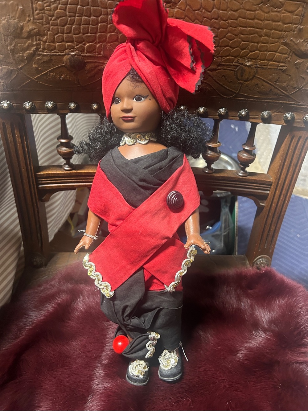 Kids Red and Black Cultural Costume with Headwrap the doll made with plastic.